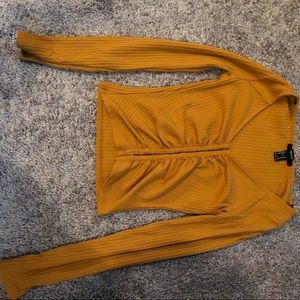 Ribbed,metal clasp, burnt orange long sleeve shirt
